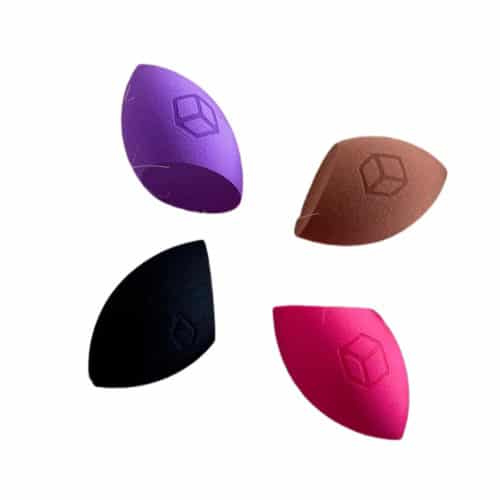 Five silicone breast forms in purple, brown, black, and pink on a white background.