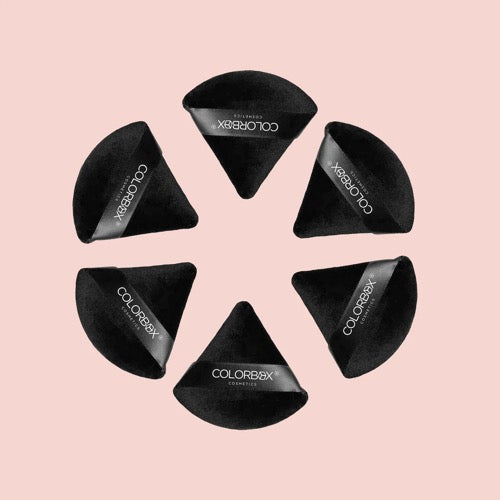 Black makeup sponges with 'ColorBox' branding on a pink background