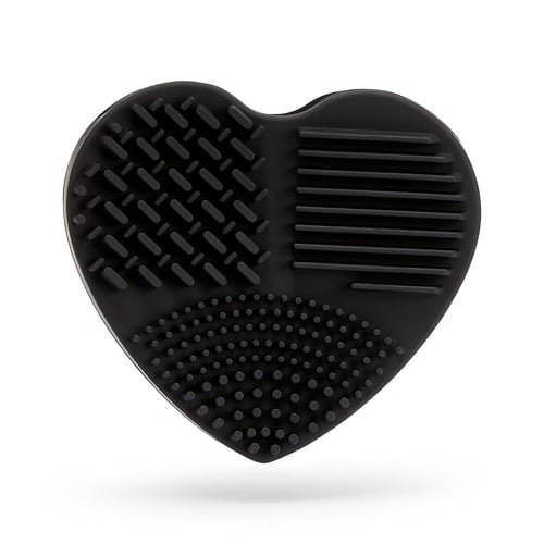 Black heart-shaped grooming brush on a white background