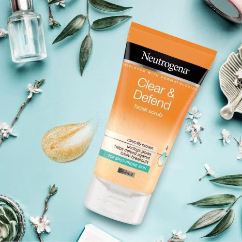 Neutrogena Clear & Defend facial scrub tube on a light blue background with decorative elements.