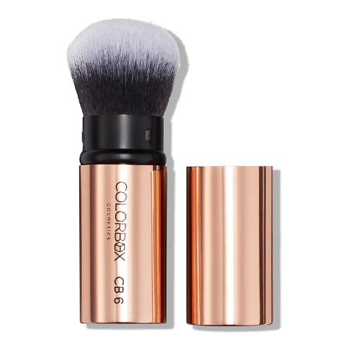 Makeup brush with rose gold handle and black bristles on a white background